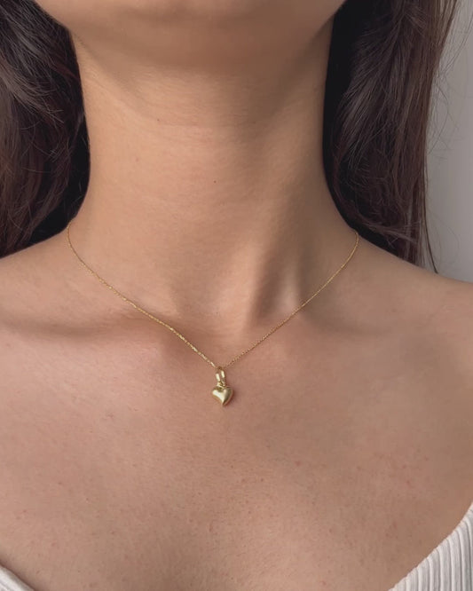 Gold Minimal Heart Necklace featuring a tiny heart pendant in a jewelry box