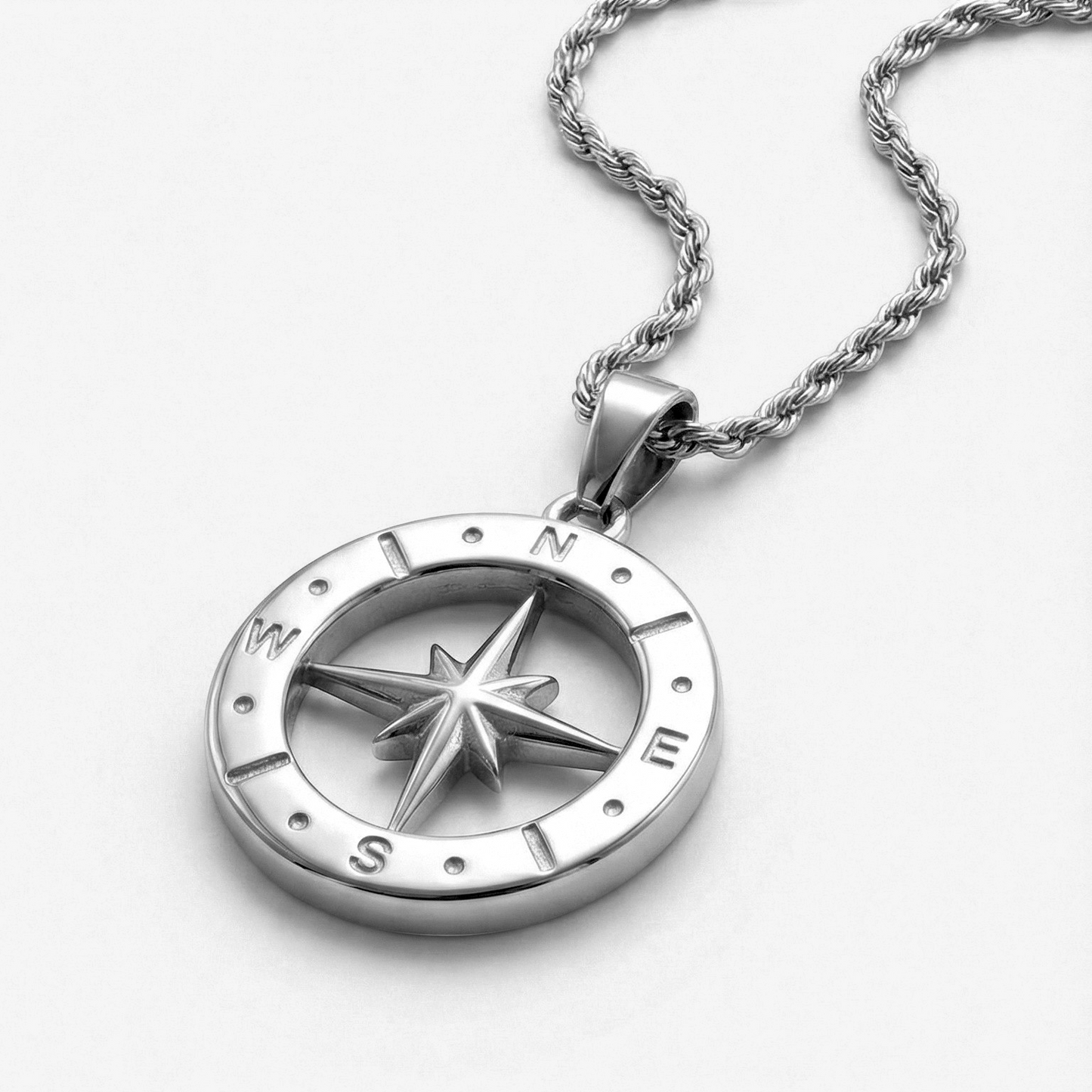 Front view of the Polaris NSEW compass pendant crafted from 316L stainless steel with a durable rope chain for men.