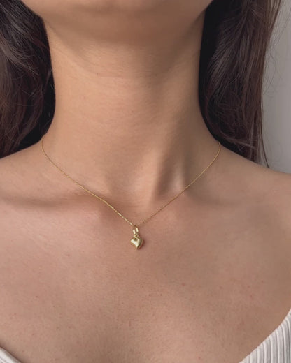 Gold Minimal Heart Necklace featuring a tiny heart pendant in a jewelry box