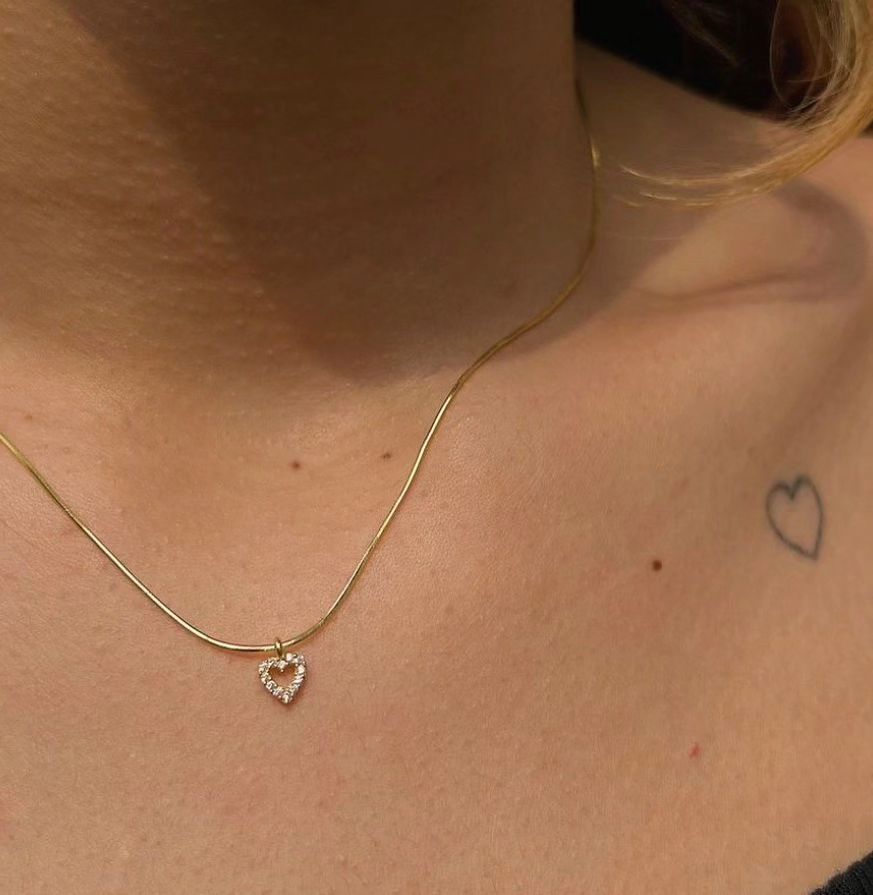 Elegant Tiny Diamond Heart Necklace styled as a delicate women's jewelry accessory