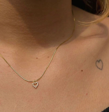 Elegant Tiny Diamond Heart Necklace styled as a delicate women's jewelry accessory