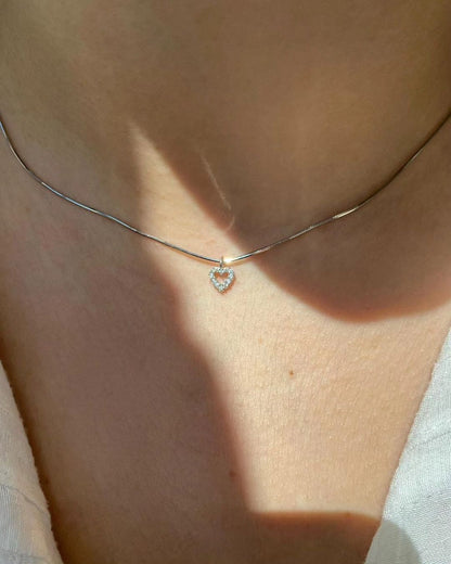 Tiny Diamond Heart Necklace displayed in a luxury jewelry gift box